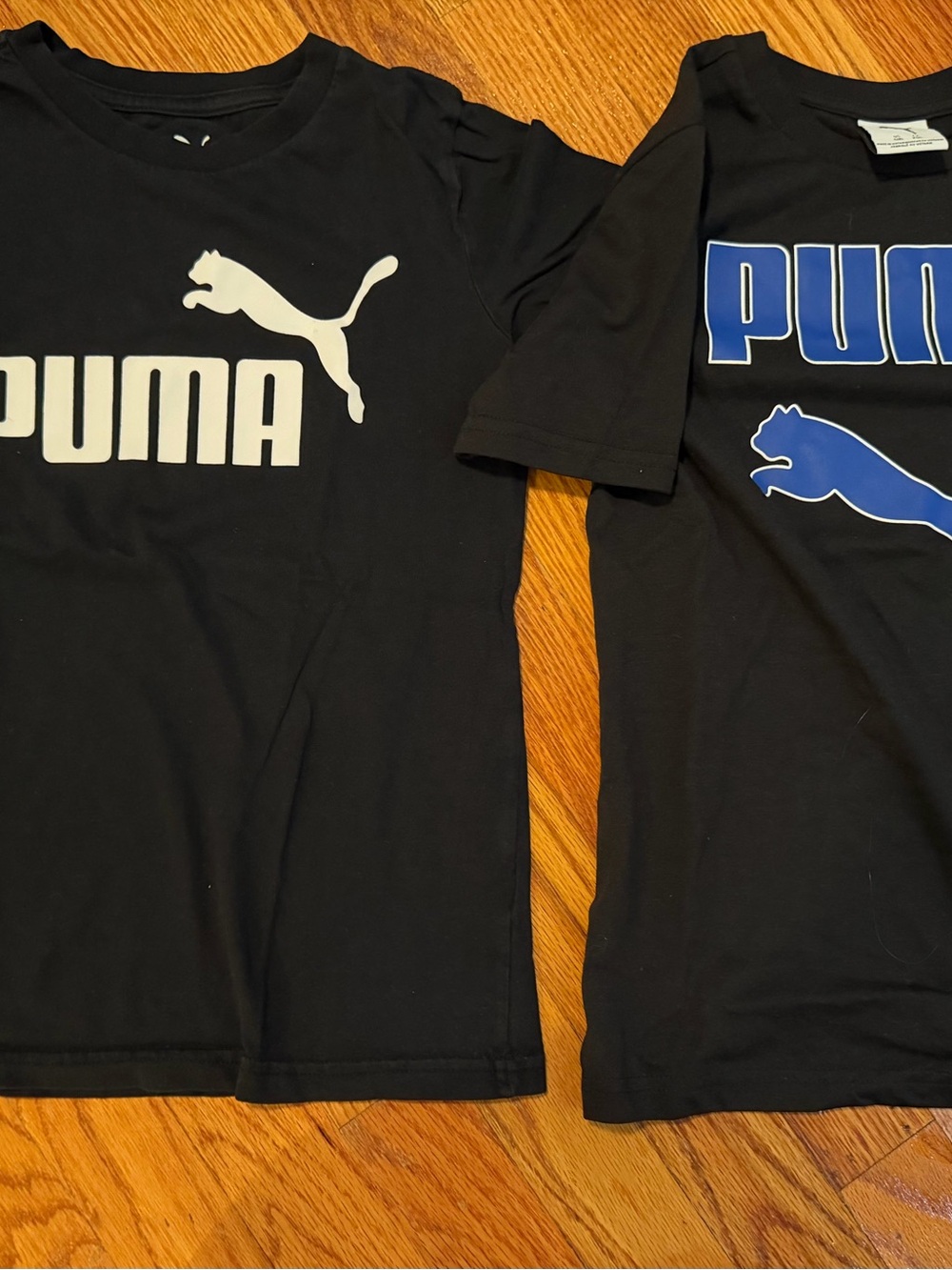 Puma Kids Black Tee with White and Blue Logos
